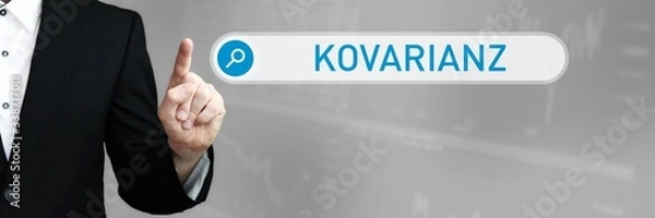 Fototapeta Kovarianz. Mann im Anzug zeigt mit dem Finger auf ein Suchfeld. Das Wort Kovarianz steht in der Suche. Symbol für Business, Finanzen, Statistik, Analyse, Wirtschaft