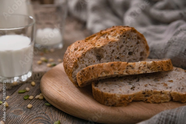 Fototapeta Meal with milk and bread in the country on World Milk Day. Horizontal shot from above.