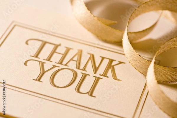 Fototapeta Closeup of thank you card with ribbon