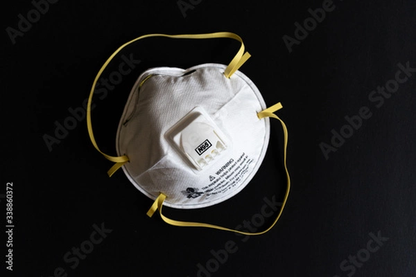 Obraz Protective masks on black background. N95 mask on the black background.  Medical and construction PPE. Respirator mask.