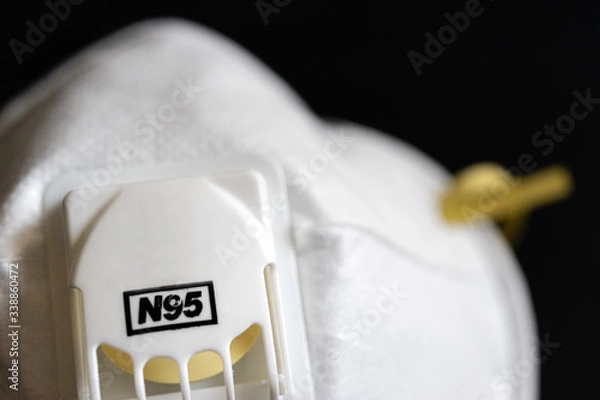 Obraz Protective masks on black background. N95 masks on a black background. Medical and construction protective equipment. N95 masks M3