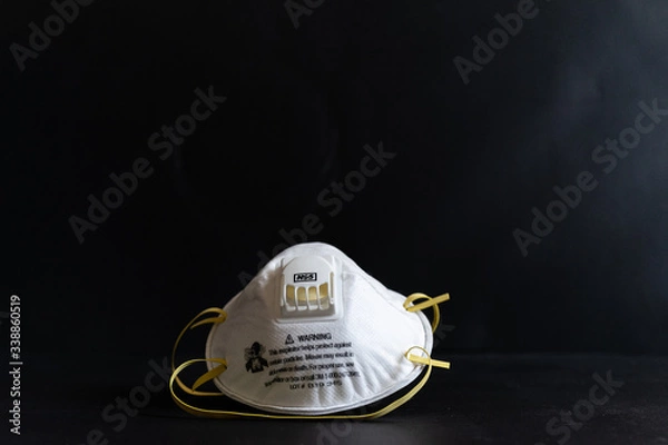 Obraz Protective masks on black background. N95 masks on a black background. Medical and construction protective equipment. N95 masks M3