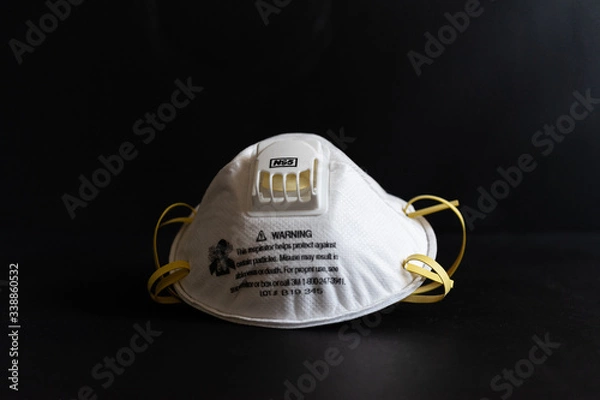 Obraz Protective masks on black background. N95 masks on a black background. Medical and construction protective equipment. N95 masks M3