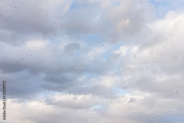 Fototapeta Fluffy white and storm clouds in sky