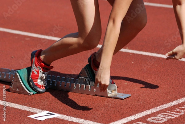 Fototapeta runner running on the track in the stadium