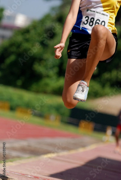 Fototapeta long jump competition at the sport centre