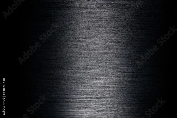 Obraz Texture of black anodized brushed aluminum with light reflection in the center