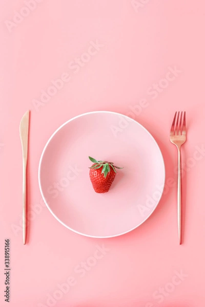 Obraz Fork with strawberry on plate top view