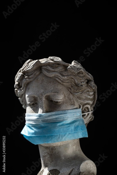 Fototapeta antique statue head in a protective mask