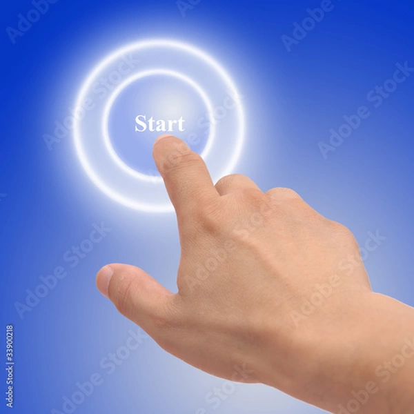 Obraz hand pressing start button on a touch screen