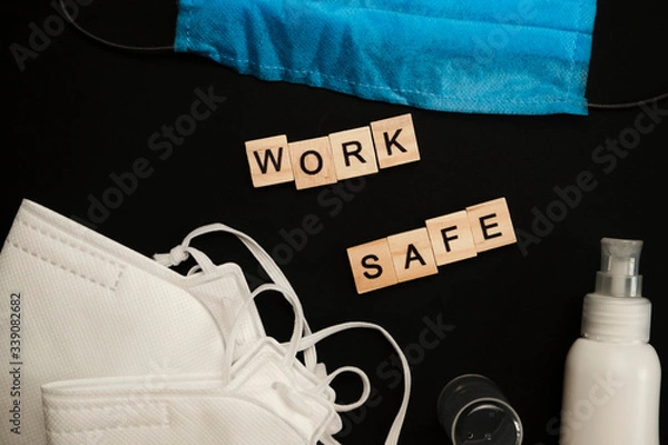 Fototapeta safety first concept with personal protection for workers on bright background