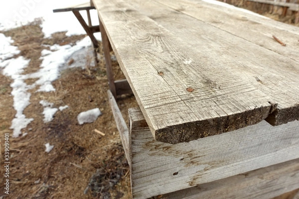 Obraz Old rusty nails driven into the Board, old wooden scaffolding. Wooden background, closeup with blur.