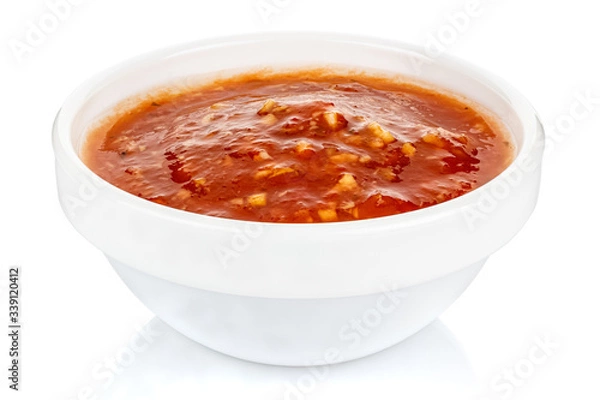 Obraz Hot tomato sauce with spices and salt in a small white ceramic round bowl isolated on white background