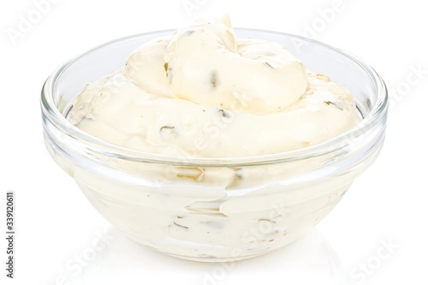 Obraz Tartar sauce with onions and pickled cucumbers in a small transparent glass round bowl isolated on white background
