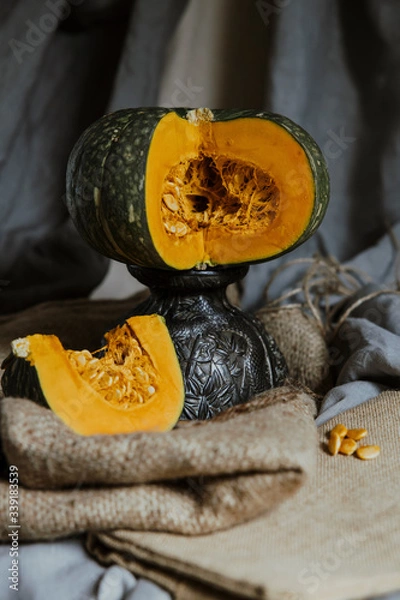 Fototapeta delica pumpkin in the garden. Kabocha, is Japanese pumpkin slice or green pumpkin on Grey background