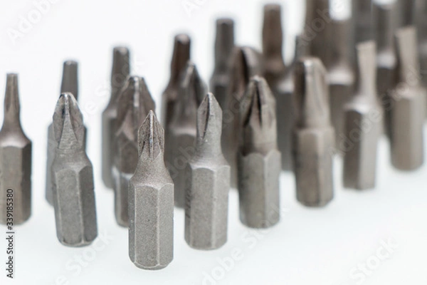 Fototapeta Tool kit for home and repair. Screwdriver with nozzles of different types on a white background.
