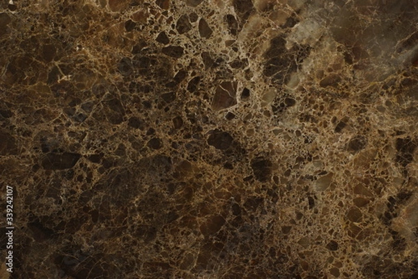 Fototapeta A slab with a texture of natural brown marble with a beautiful pattern, called Emperador Dark