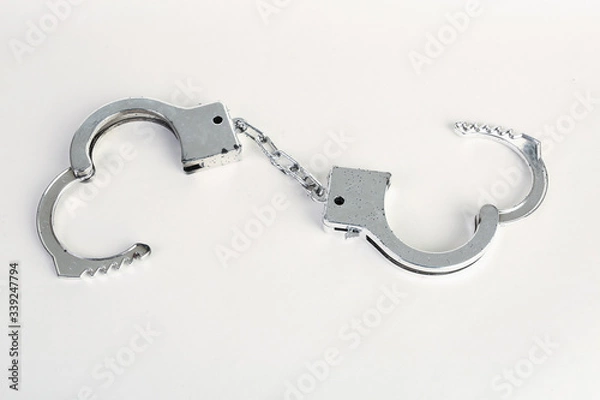 Obraz Hand cuffs on a white background