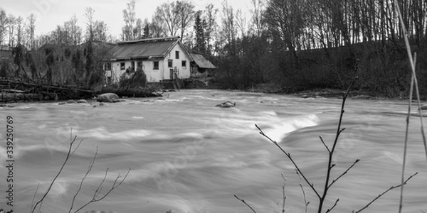 Obraz Old factory building by a river