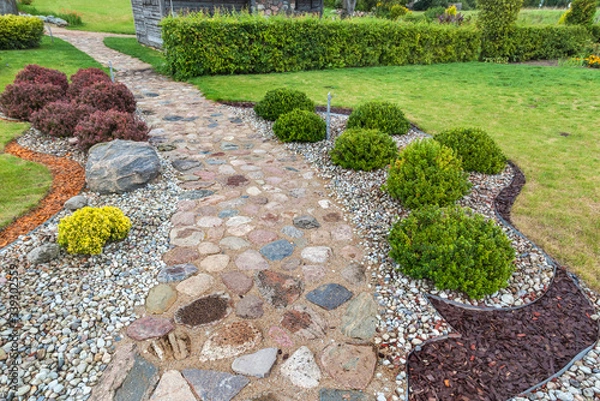 Obraz Stone walkway in the garden of a country house