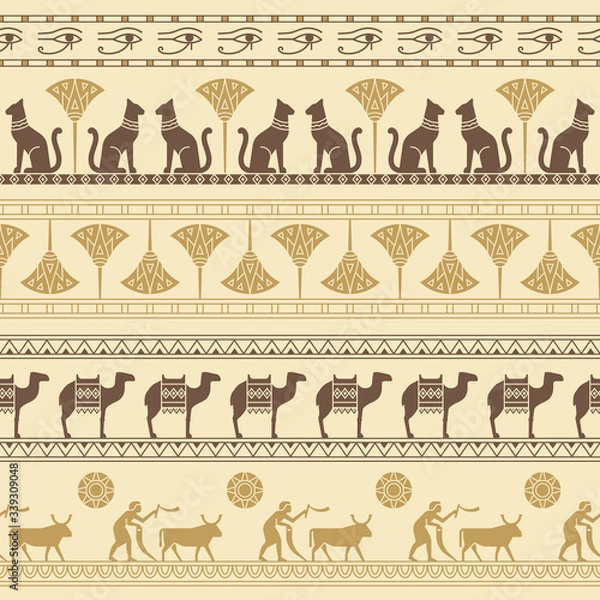 Fototapeta A seamless pattern based on the symbols of ancient Egypt. Cats, lotus flowers, camels, buffaloes and more