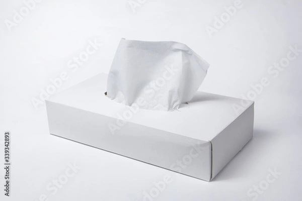 Fototapeta Napkins in a box on a white background. Box for napkins. Natural material.