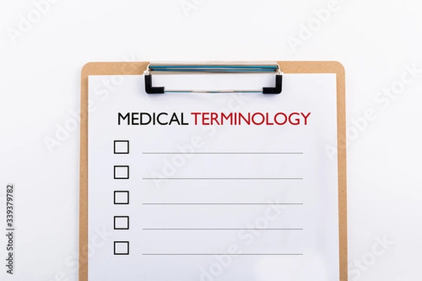 Obraz "MEDICAL TERMINOLOGY" concept. Note pad and white paper on white background