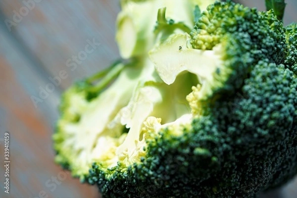 Obraz broccoli on a wooden surface