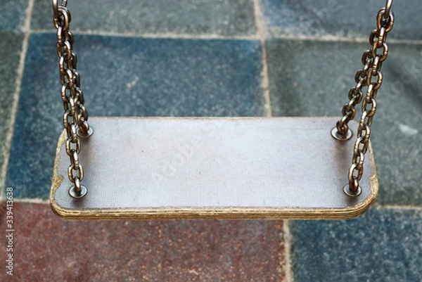 Obraz The swing is empty on the playground for children.