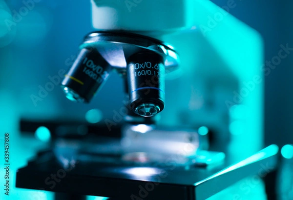 Fototapeta Close-up of scientific microscope. Laboratory in hospital. Epidemic disease, healthcare, vaccine research and coronavirus 2019-ncov test.