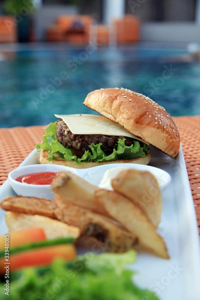 Obraz hamburger at hotel pool