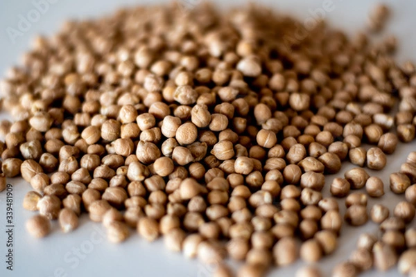 Obraz chick peas on white surface
