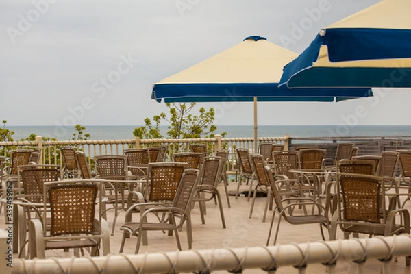 Fototapeta empty cafe terrace with sea view. No people. Concepts - Stay at home, save live, self-isolation. Coronavirus Pandemic lifestyles