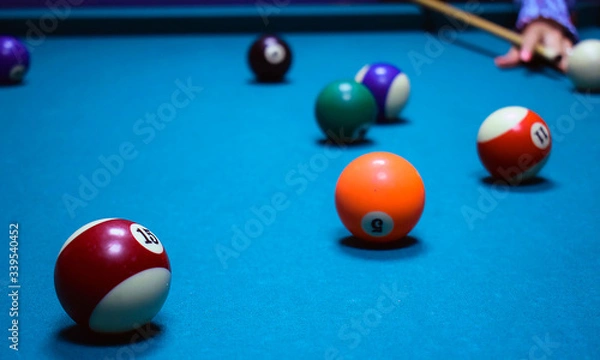 Obraz billiard balls on a green table