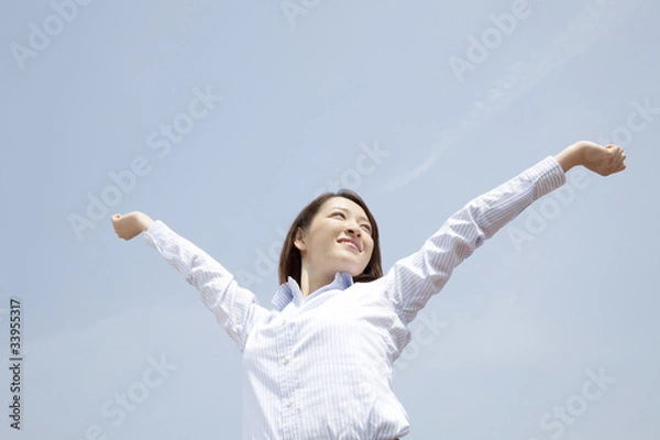 Fototapeta のびをする女性