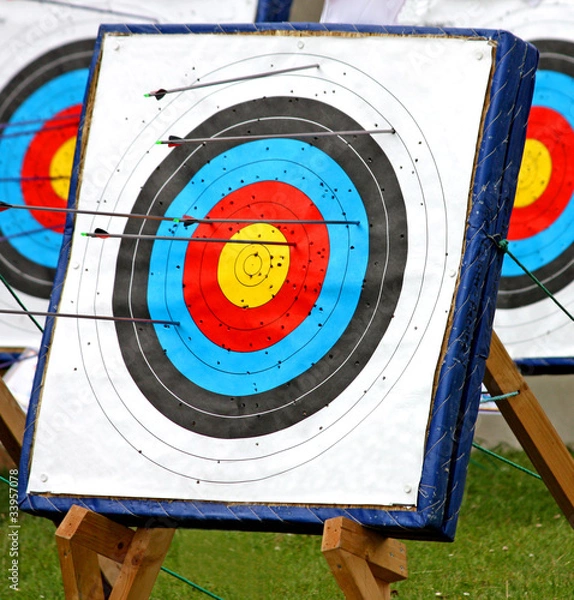 Fototapeta A Round Archery Target with Arrows in it.