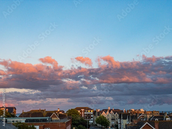 Obraz Pink clouds view with Rooftops