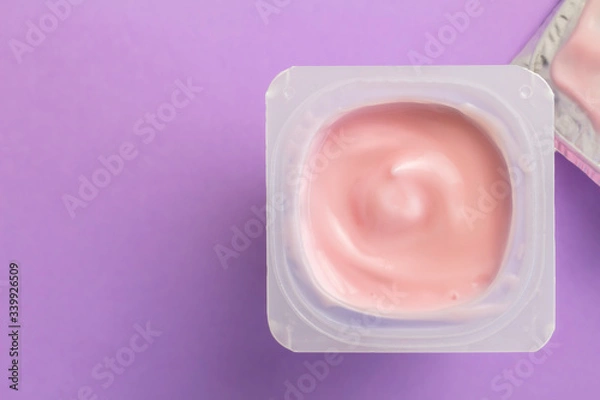 Fototapeta Yoghurt cup with strawberry yogurt