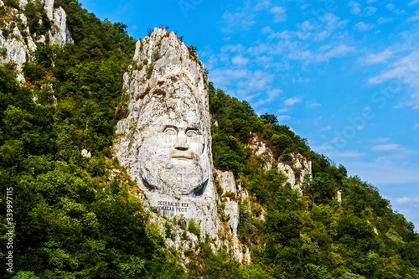 Fototapeta The face of the Dacian king Decebal is a 55 m high bas-relief located on the rocky bank of the Danube, between the towns of Echelnita and Dubova, near the city of Orsova, Romania.