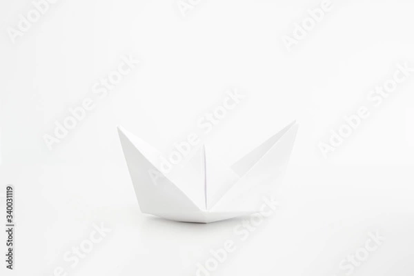 Obraz White folded paper boat frontal shot isolated on bright background