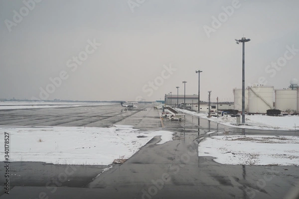 Fototapeta The runway was covered in snow, resulting in flights that canceled because of failing to fly up and down in accordance with safety standards.