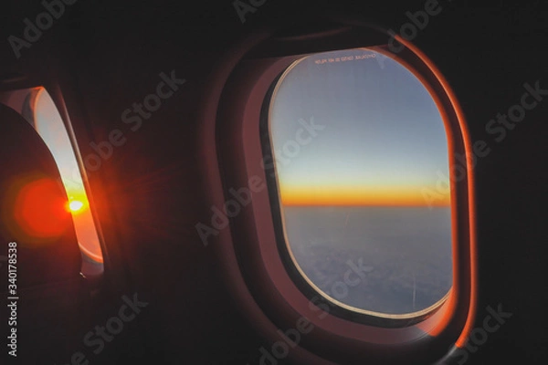 Fototapeta The first light of the day came out from behind the clouds to welcome travelers flying to Japan.