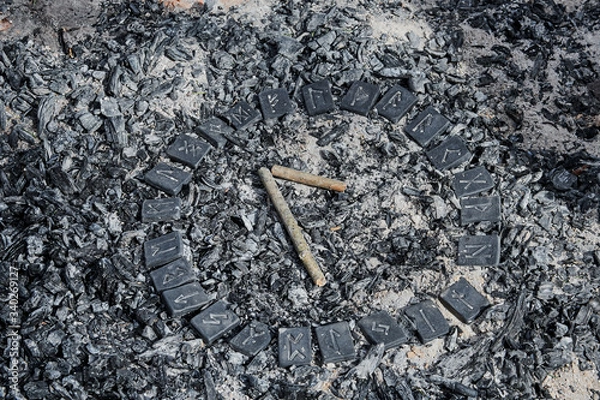 Fototapeta Norse rune Laguz on ashes backgorund inside the circle of 24 Norse runes.