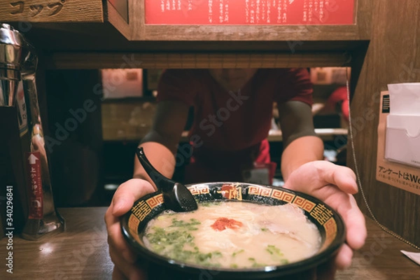 Fototapeta Tokyo, Japan - November 14, 2019: Ichiran Ramen. Ichiran is one of the most popular ramen restaurants in Japan, especially among foreign visitors.