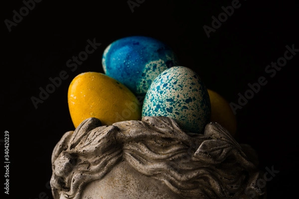 Fototapeta Easter painted eggs in a stone vase