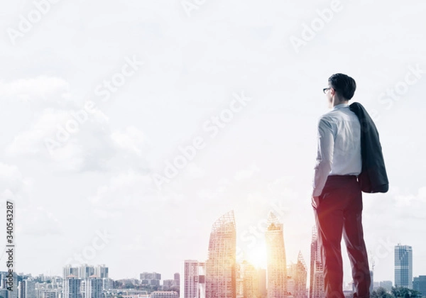 Fototapeta Concept of business success and control with confident boss against cityscape background