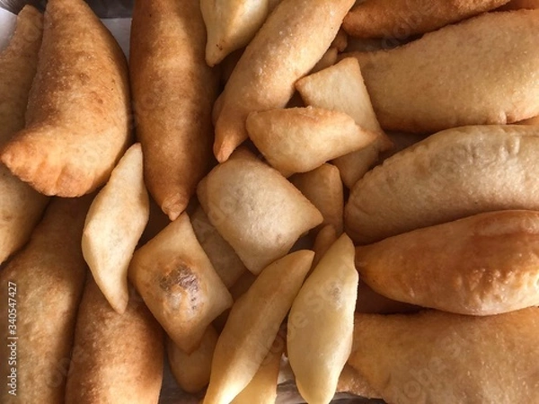 Obraz Panzerotti, a typical fried dough filled with Mozzarella cheese and tomato sauce