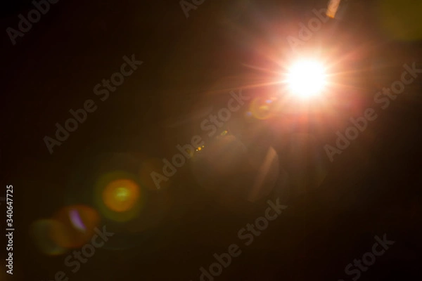 Obraz Abstract Natural Sun flare on the black background.