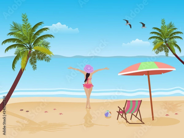 Fototapeta The woman in bikini stands happily with his hands at the seaside. There are coconut trees and blue skies in the background.
