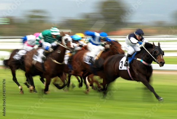 Obraz Horse Racing at race track motion blur as jockey fights exciting contest for victory